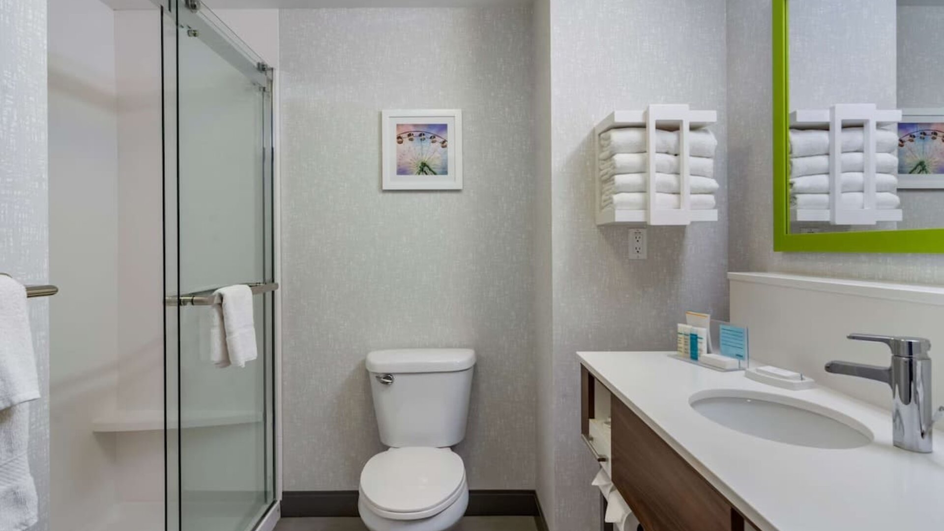 Private guest bathroom with shower and free toiletries at Hampton Inn & Suites By Hilton Edmonton/West.