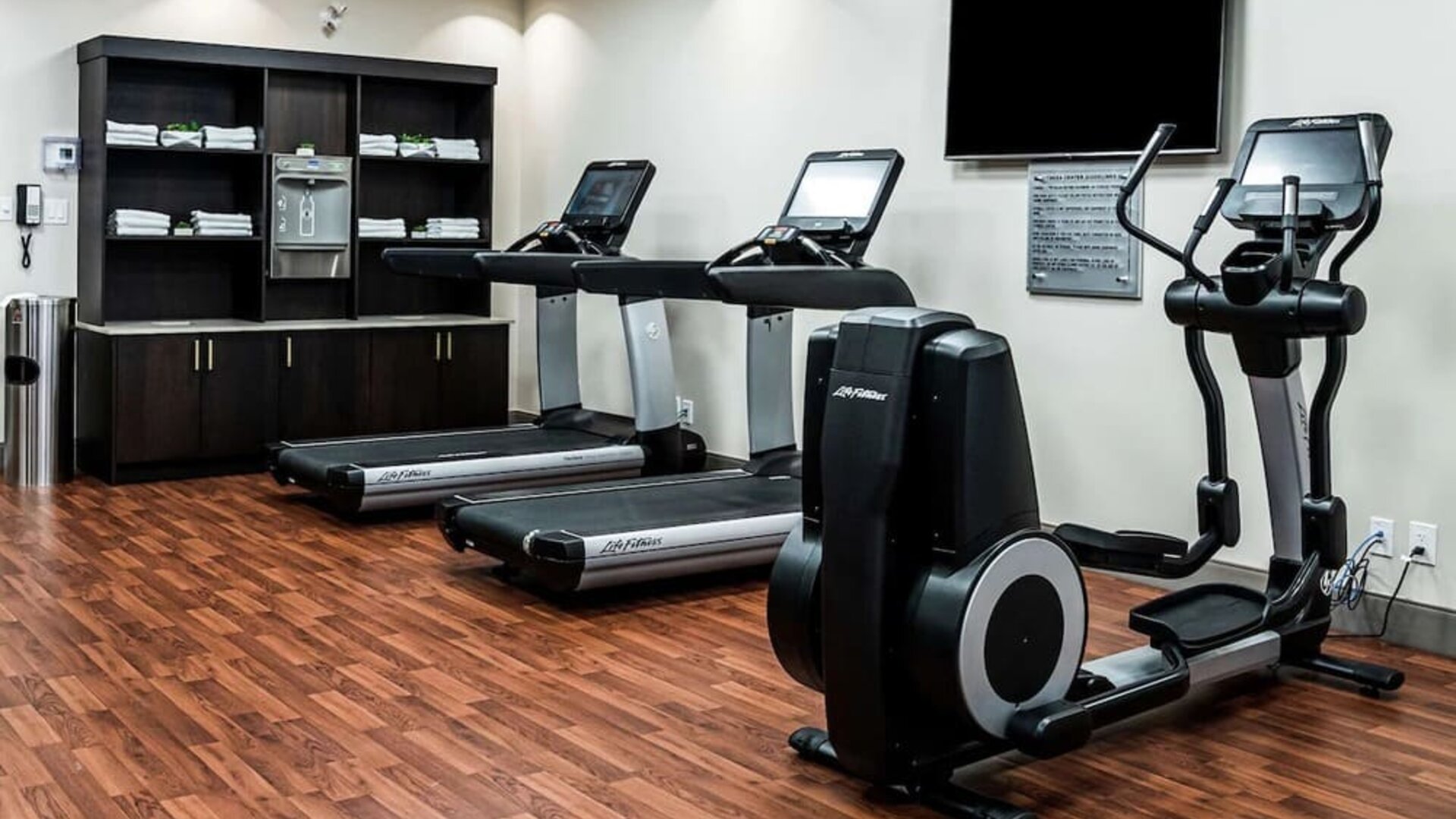 Fitness center with treadmills and machines  at DoubleTree By Hilton Kitchener.