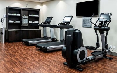 Fitness center with treadmills and machines  at DoubleTree By Hilton Kitchener.