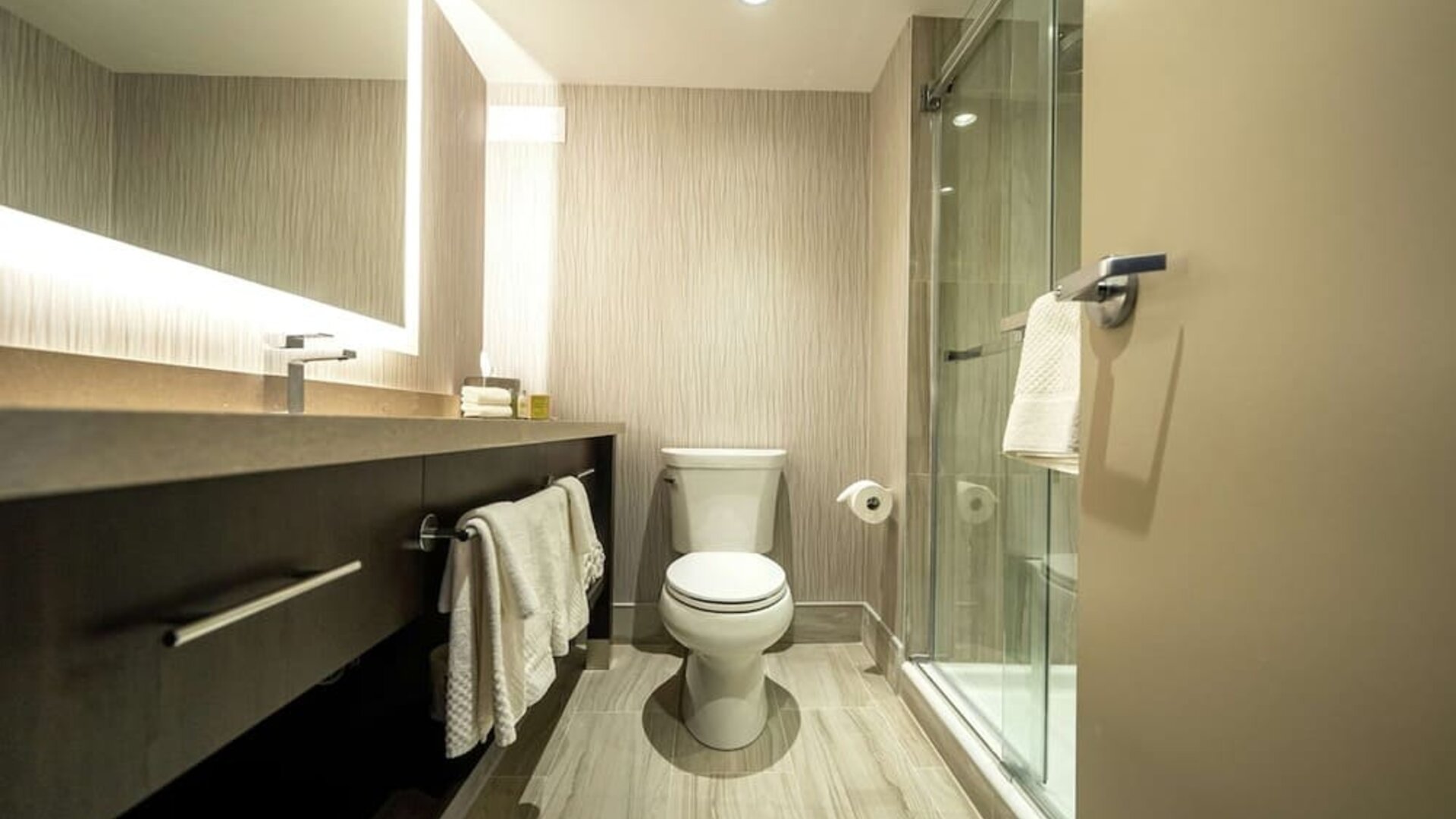 Private guest bathroom with shower and free toiletries at DoubleTree By Hilton Kitchener.