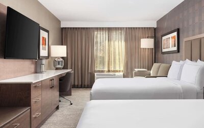 Twin day use room with TV, work desk and private bathroom  at DoubleTree By Hilton Kitchener.