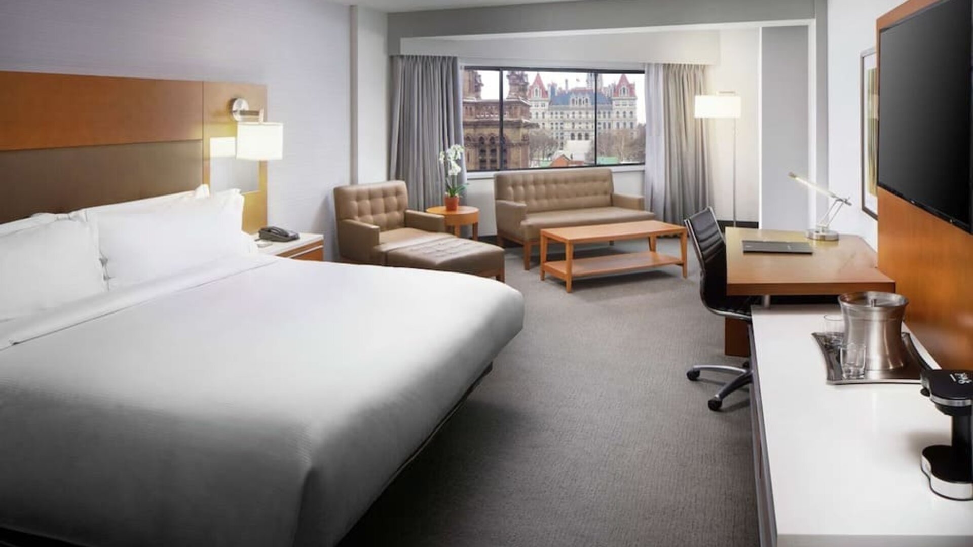 Day use room with work desk and sofa at Hilton Albany.
