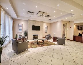 Hotel lobby with lounge area at Amenida Residences.