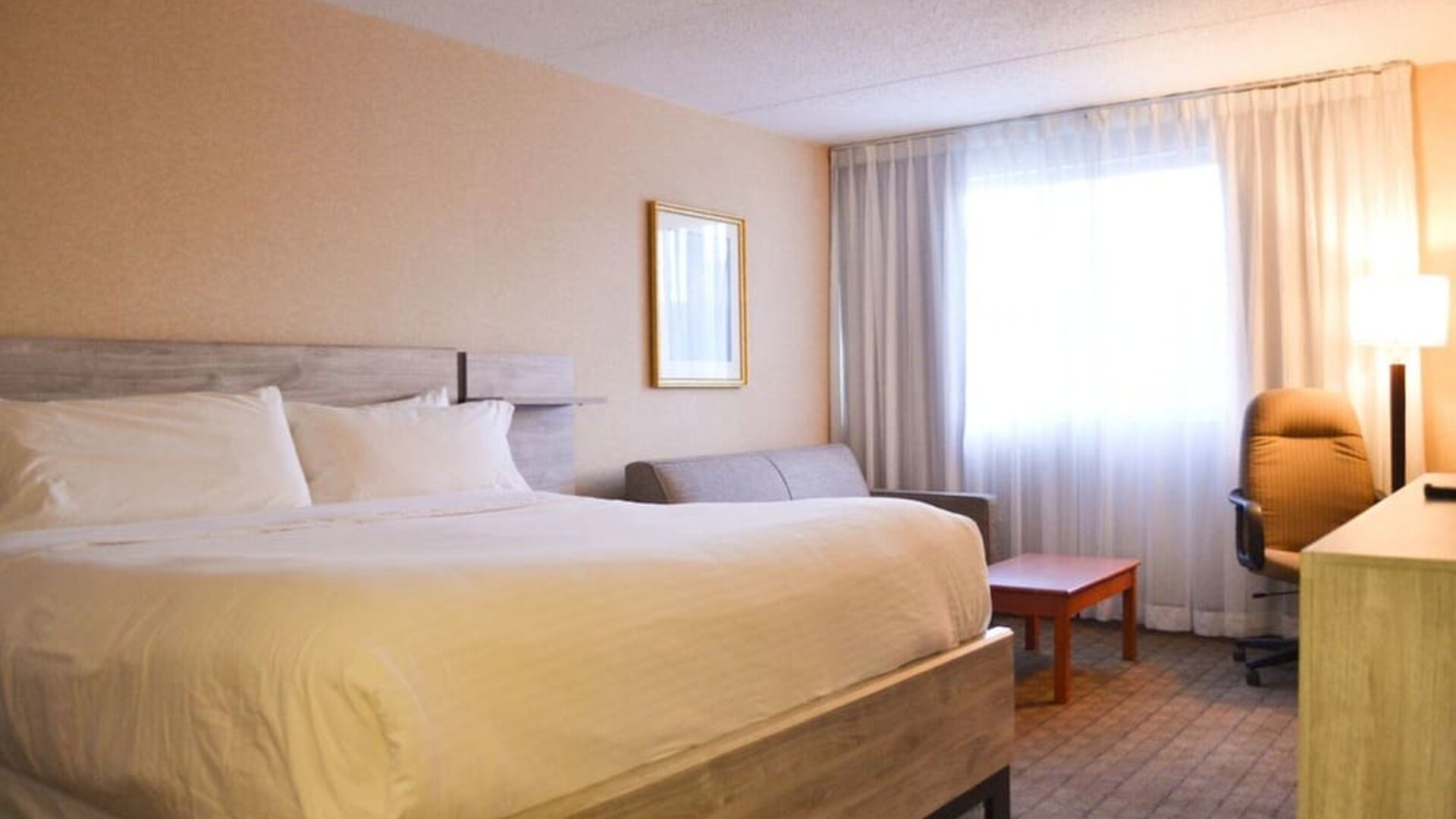 Day use room with sofa, work desk and private bathroom at Amenida Residences.