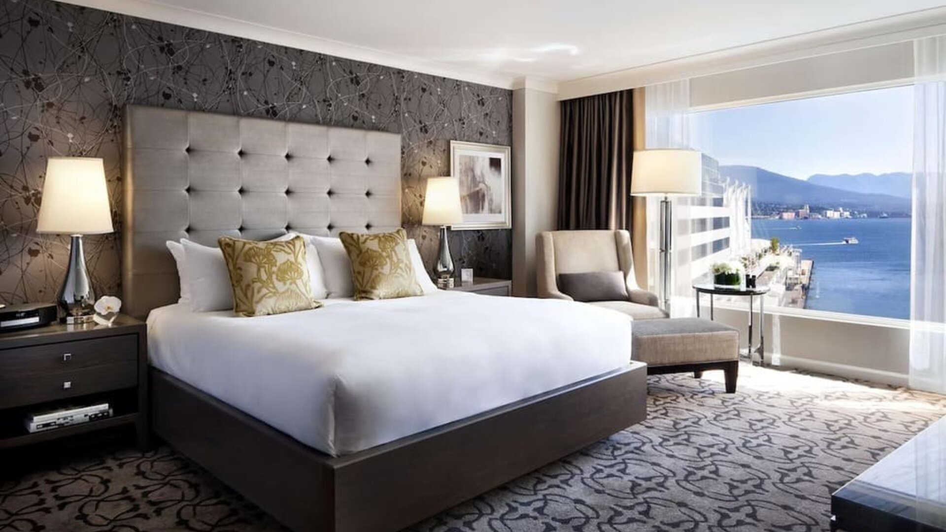 Day use room with TV, work desk, sofa and private bathroom at the Fairmont Waterfront.