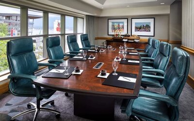 Professional meeting room with large windows and ergonomic chairs at the Fairmont Waterfront.