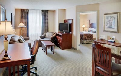 Studio suite with living room, kitchen, work desk and private bathroom at Staybridge Suites Oakville-Burlington.