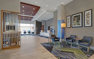 Hotel lobby with lounge area at Holiday Inn Express Kingston West.