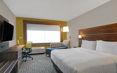 Day use room with TV, sofa, work desk and private bathroom at Holiday Inn Express Kingston West.