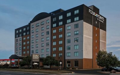 Hotel exterior and parking area at Four Points By Sheraton Toronto Mississauga.
