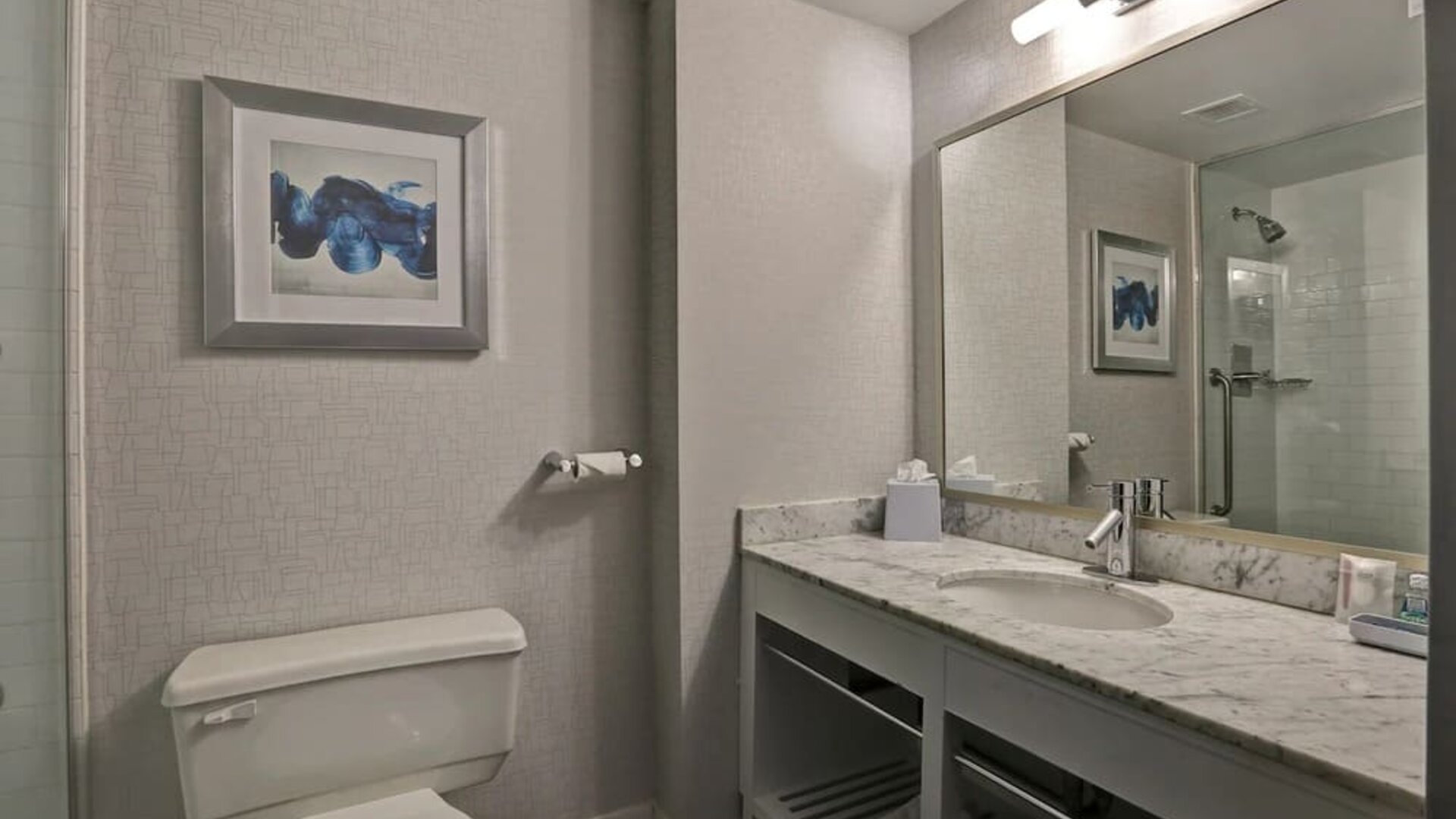 Private guest bathroom with shower and free toiletries at Four Points By Sheraton Toronto Mississauga.
