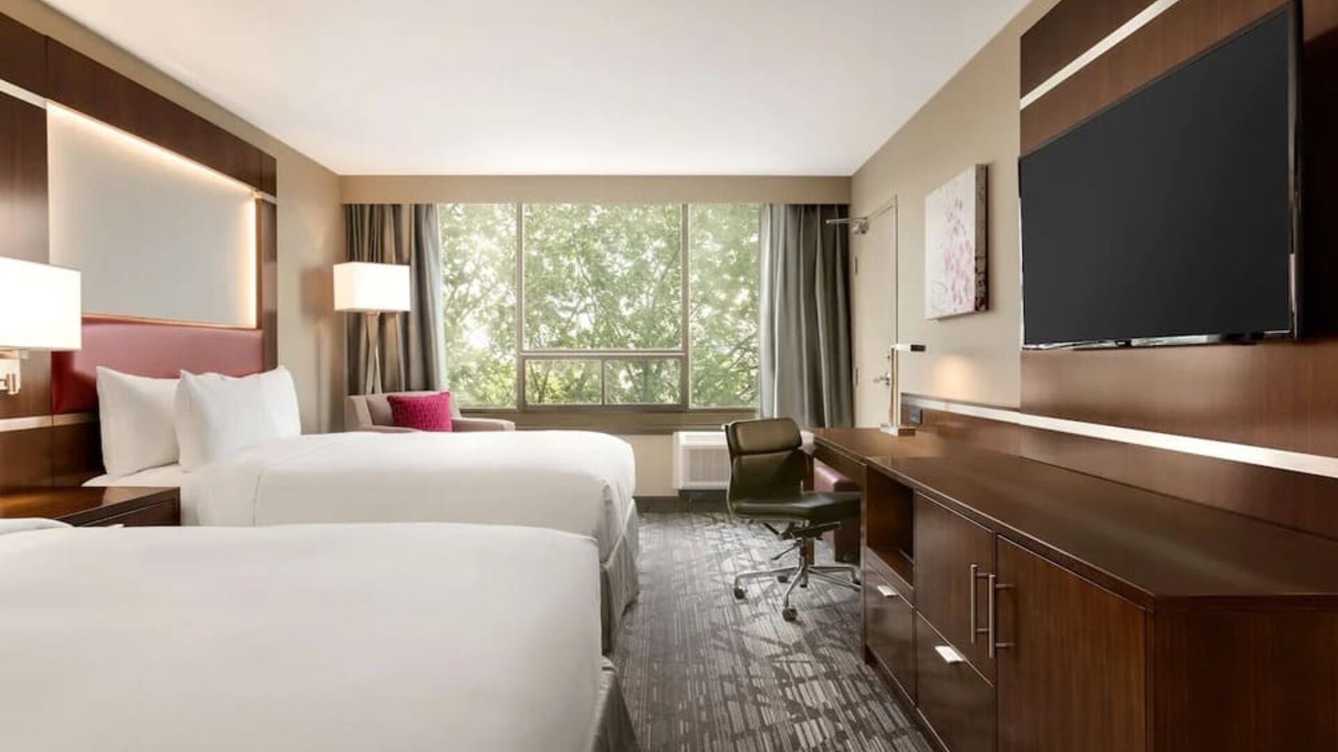 Day use twin room with large windows, TV, sofa, work desk and private bathroom at DoubleTree By Hilton Hotel Toronto Airport West.