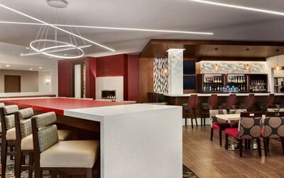 Stylish hotel bar with comfortable seating at DoubleTree By Hilton Hotel Toronto Airport West.