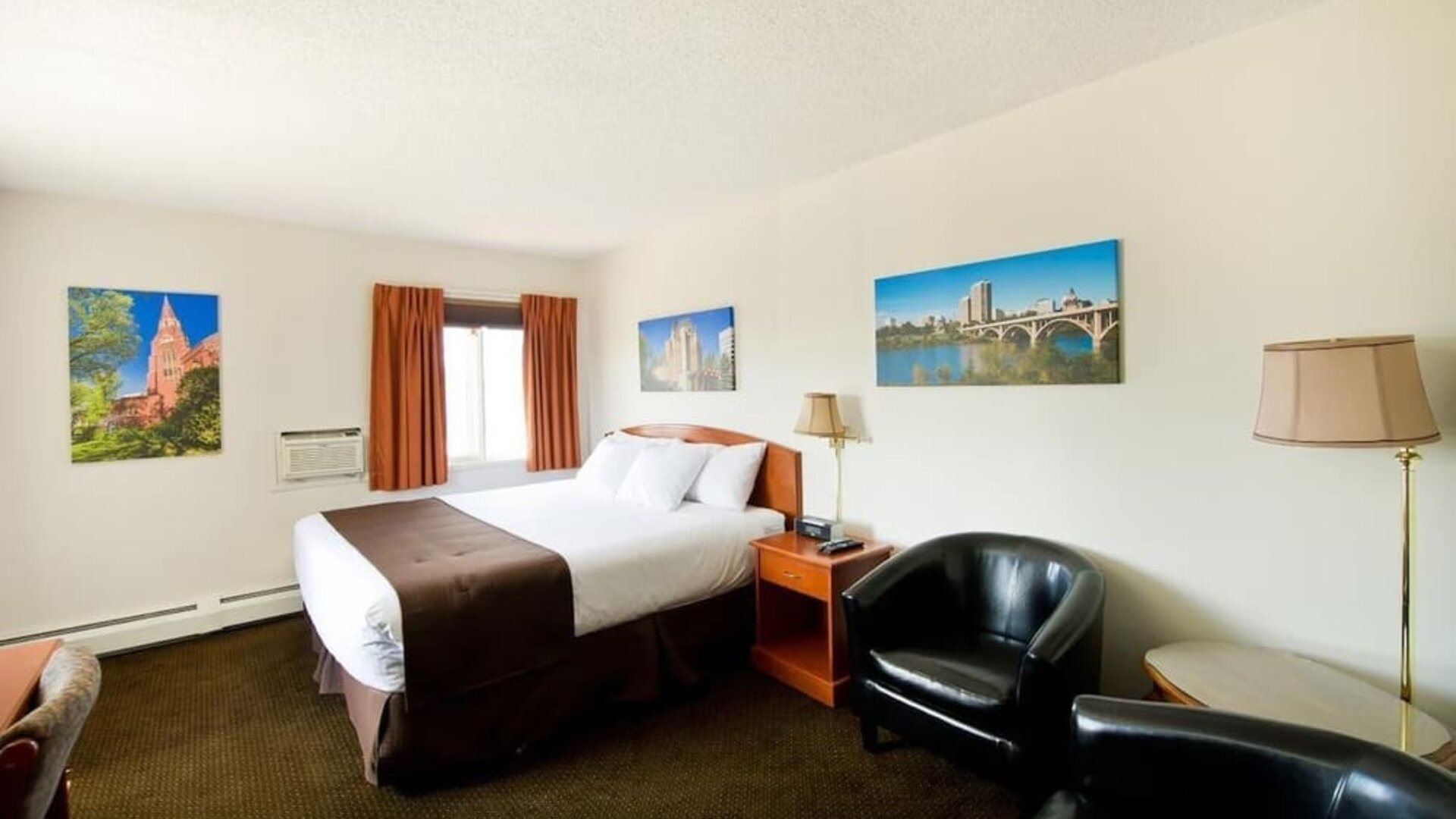 Day use room with lounge area, work desk and private bathroom at Riviera Motor Inn.