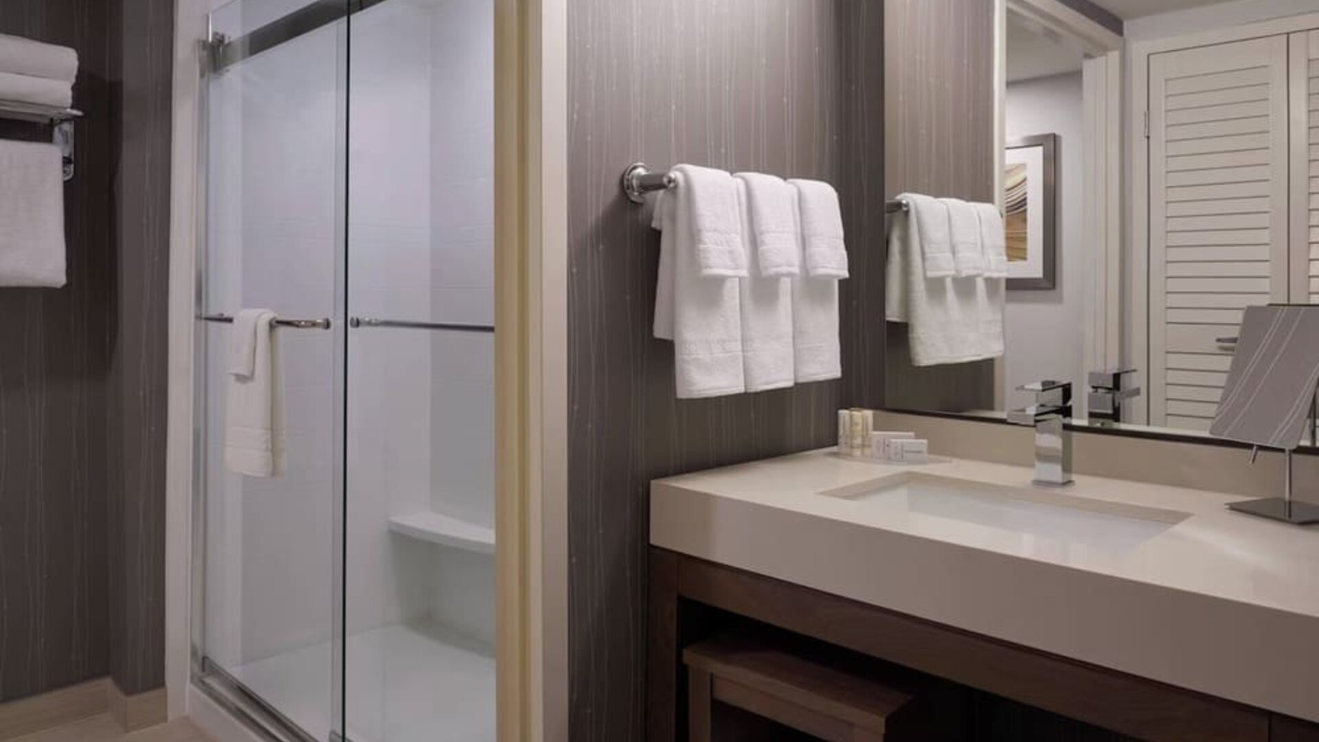 Private guest bathroom with shower and free toiletries at Courtyard By Marriott Toronto Airport.