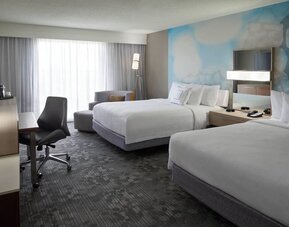 Day use twin room with TV, coffee maker, sofa, work desk and private bathroom at Courtyard By Marriott Toronto Airport.