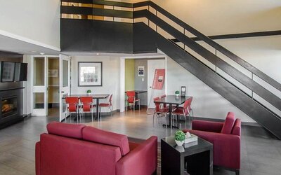 Hotel lobby and lounge area with fireplace, perfect for co-working at Comfort Inn Swift Current.