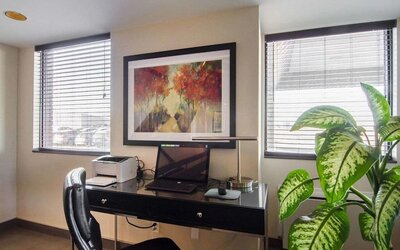Business center with computer, printer and ergonomic chair at Comfort Inn Swift Current.