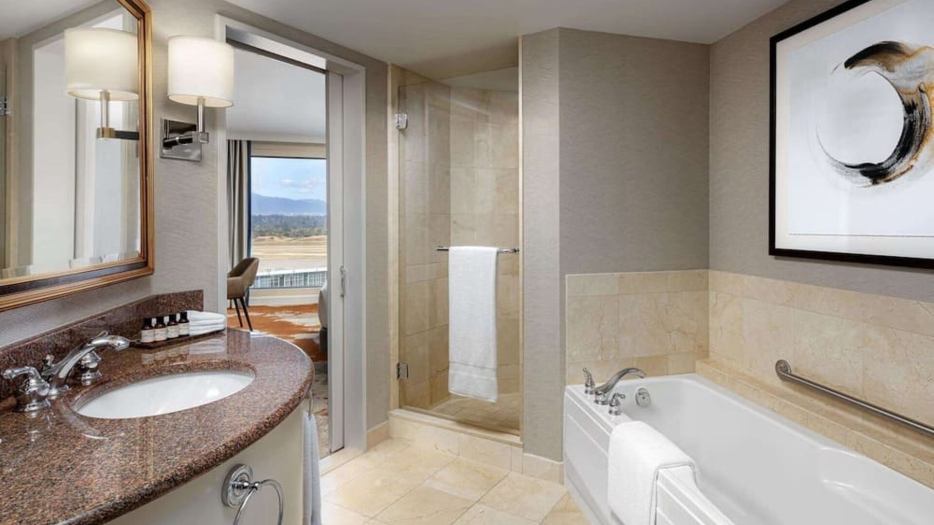 Private guest bathroom with shower and tub at Fairmont Vancouver Airport - YVR Terminal Hotel.