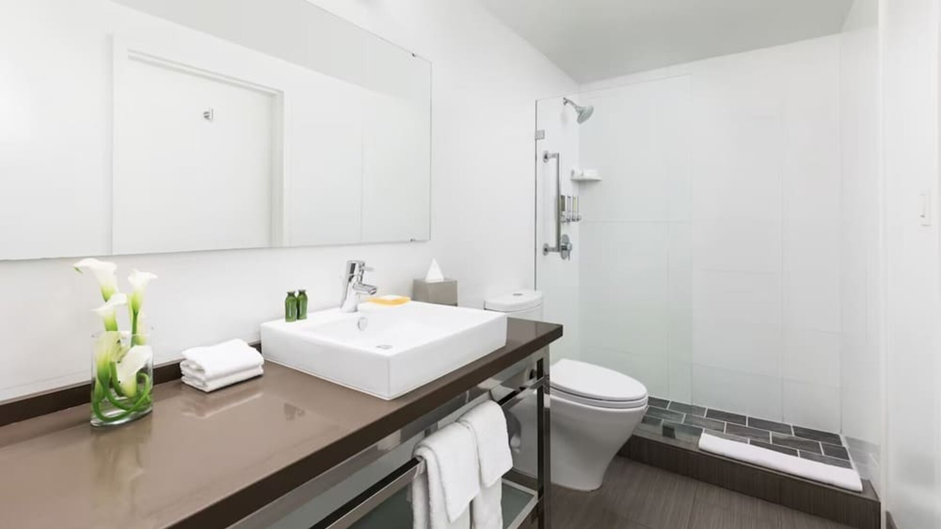 Guest bathroom with shower at YVE Hotel Miami.