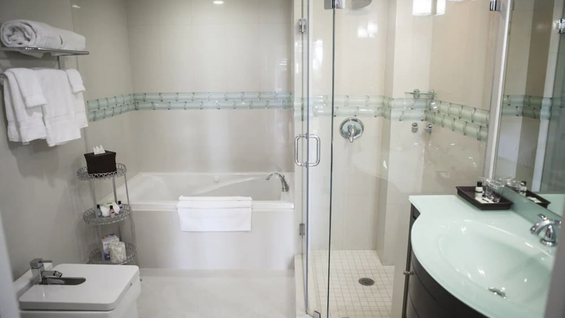 Guest bathroom with shower and tub at The Mutiny Hotel.