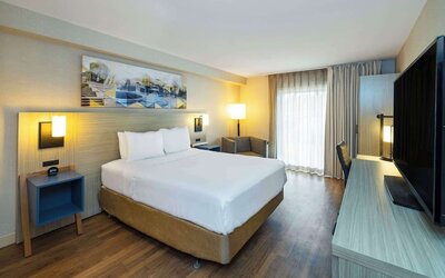 Standard day use room with TV, sofa, work desk and private bathroom at Comfort Inn Corner Brook.