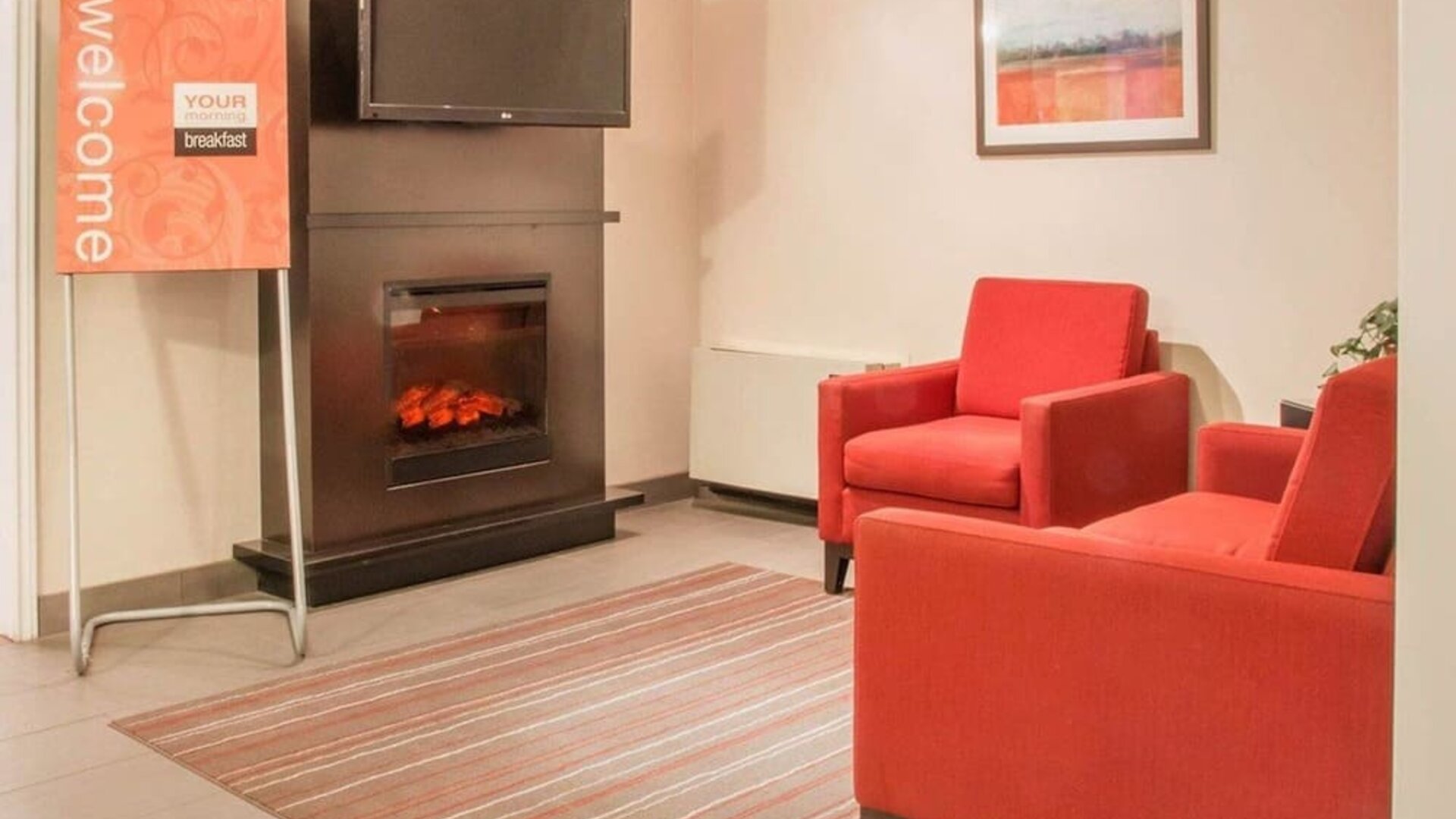 Lobby lounge with fireplace at Comfort Inn Winnipeg II South.