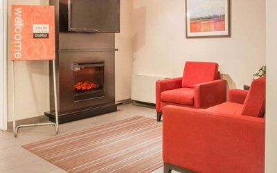 Lobby lounge with fireplace at Comfort Inn Winnipeg II South.