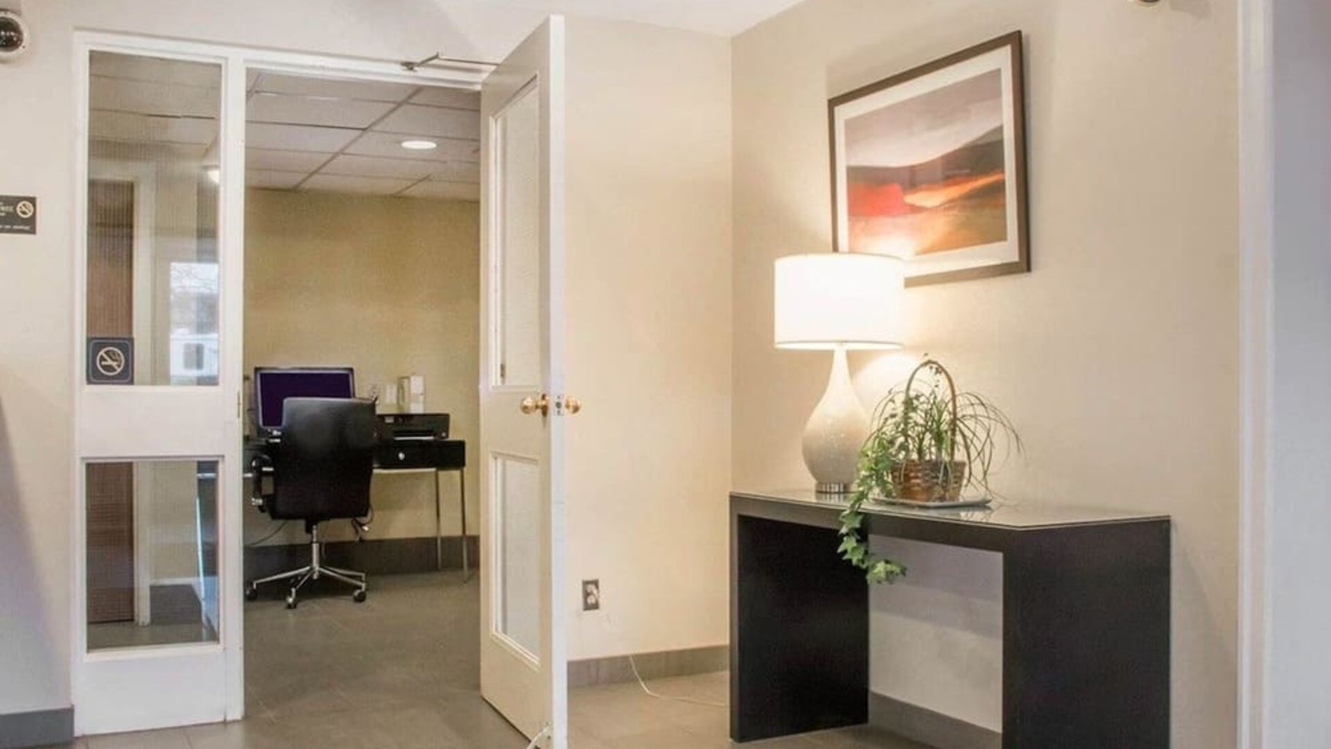 Business center with computer, printer and ergonomic chair at Comfort Inn Winnipeg II South.