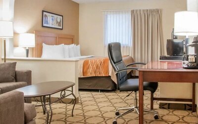 Day use suite with work desk and living area at Comfort Inn Winnipeg II South.