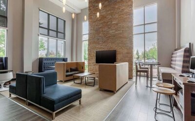 Lobby and coworking lounge at Cambria Suites Denver Airport.