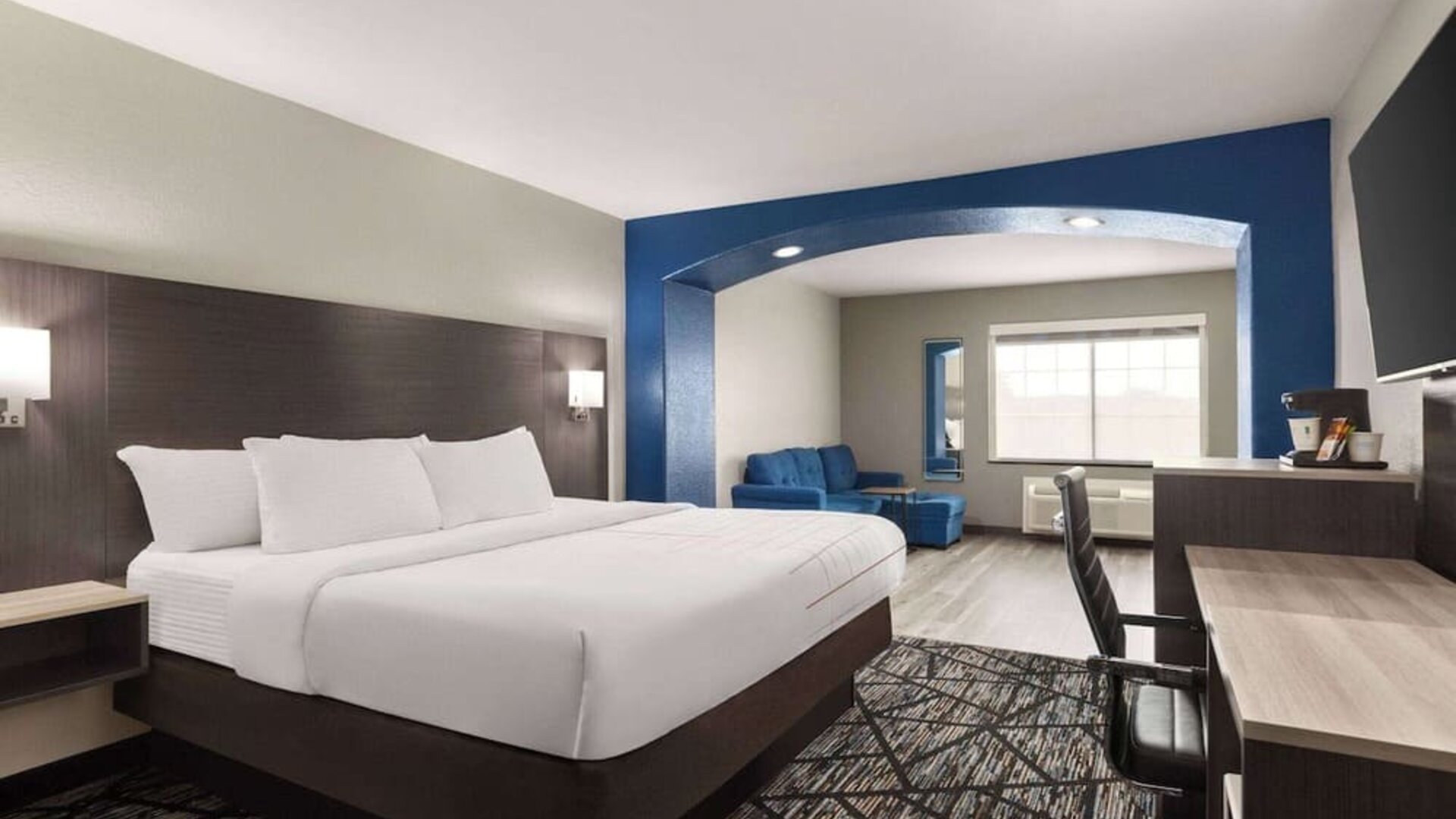 Day use room with living area and work desk at La Quinta Inn & Suites - North Stone Oak.
