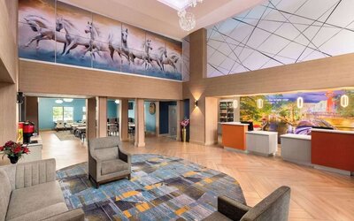 Lobby and coworking lounge at La Quinta Inn & Suites - North Stone Oak.