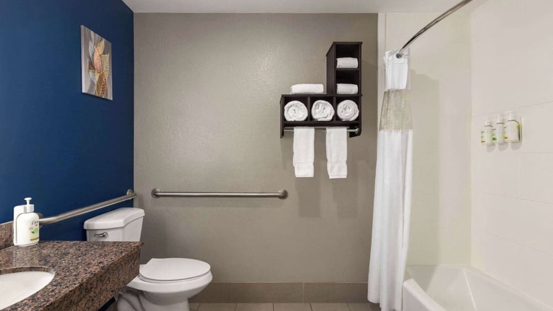 Guest bathroom with shower and tub at La Quinta Inn & Suites - North Stone Oak.