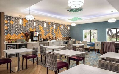 Dining area perfect for coworking at La Quinta Inn & Suites - North Stone Oak.