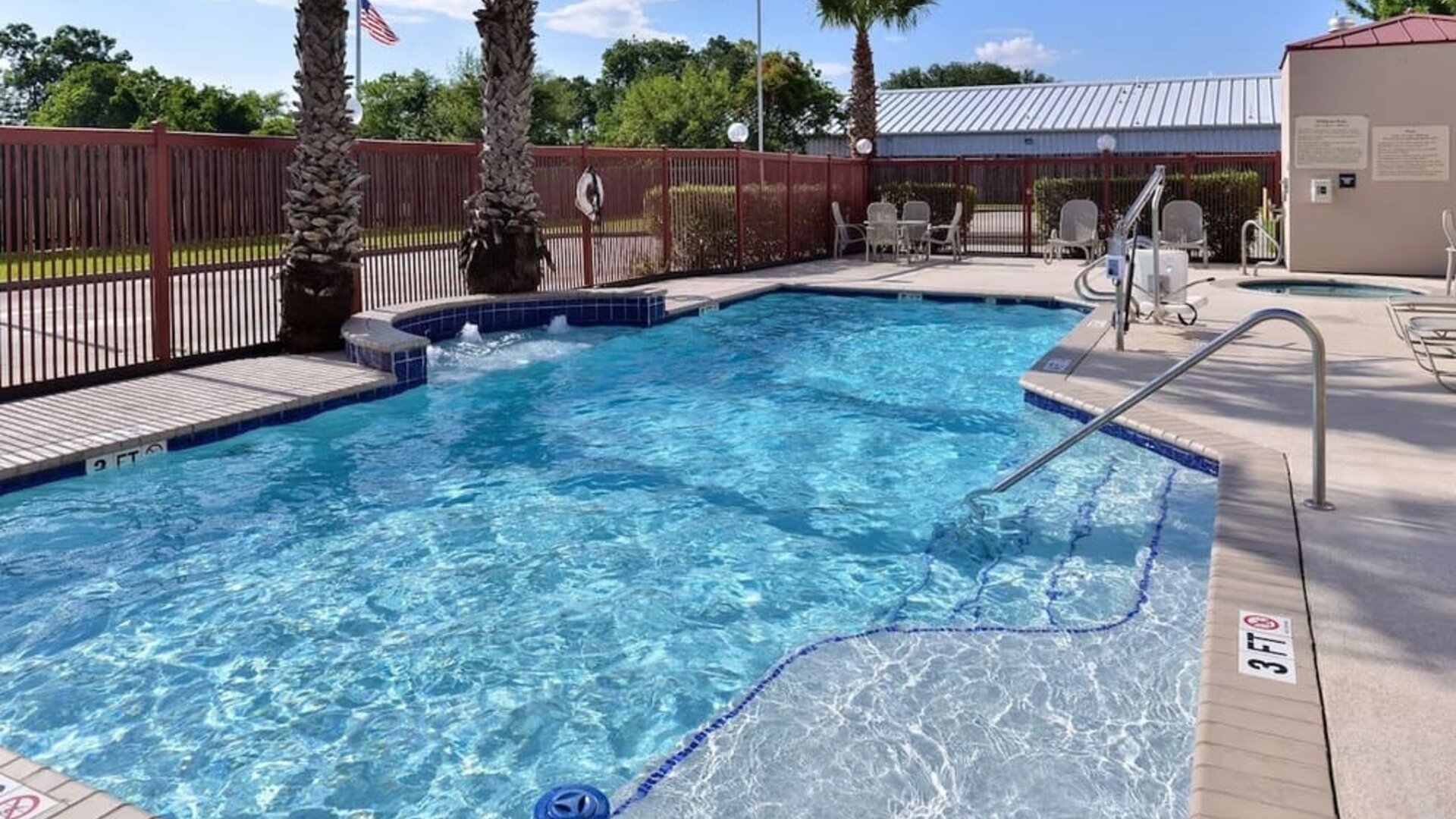 Refreshing outdoor pool at Hampton Inn Deer Park.