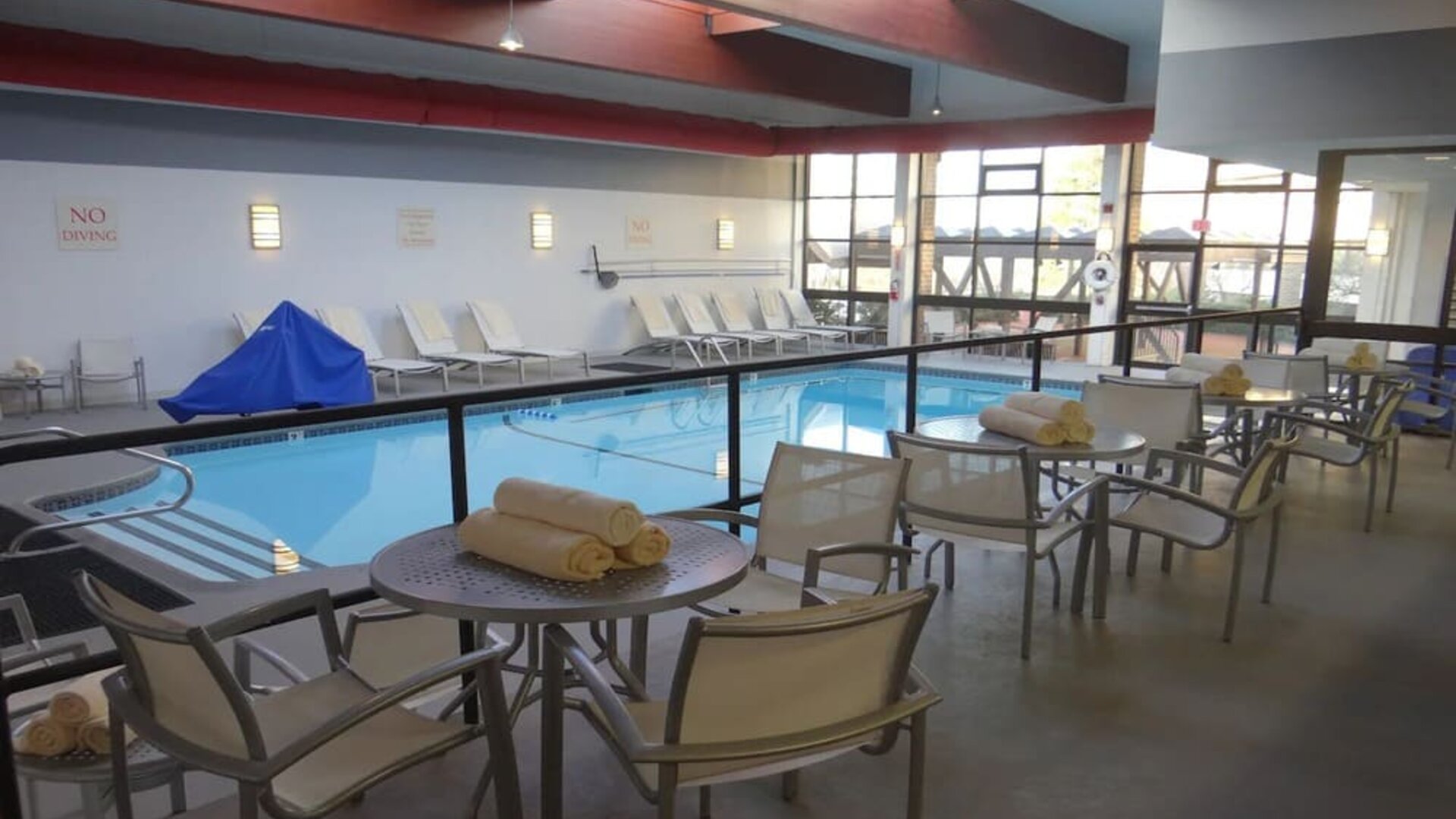 Tables and chairs available beside pool at DoubleTree By Hilton Westborough.