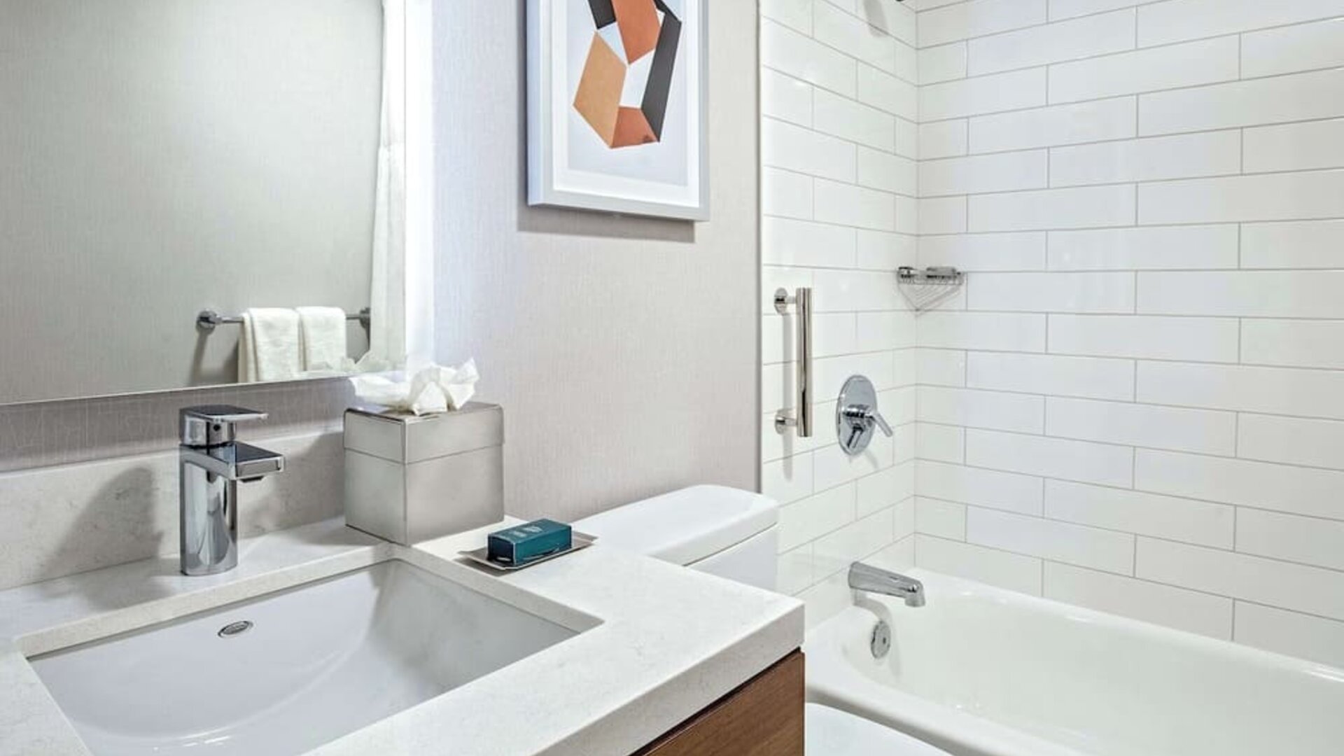 Guest bathroom with shower and tub at DoubleTree By Hilton Westborough.