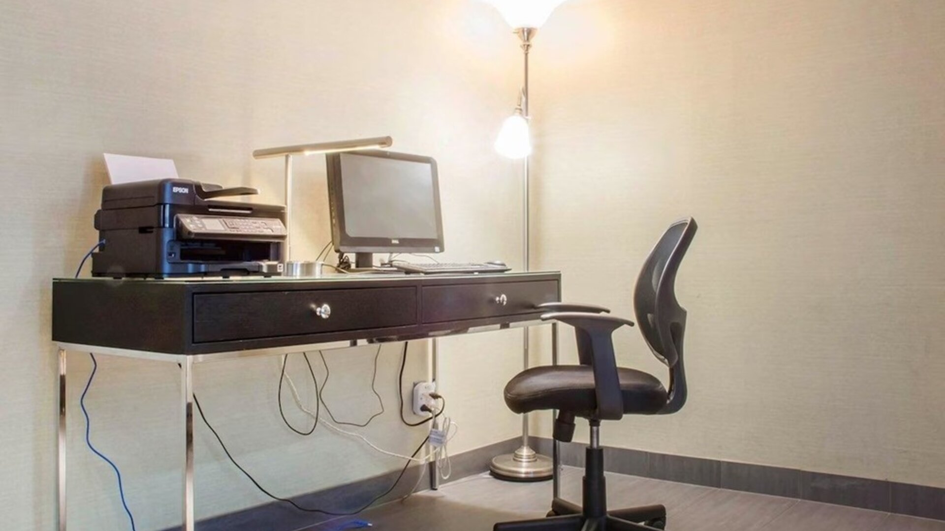 Business center with computer, printer and ergonomic chair at Comfort Inn Parry Sound.