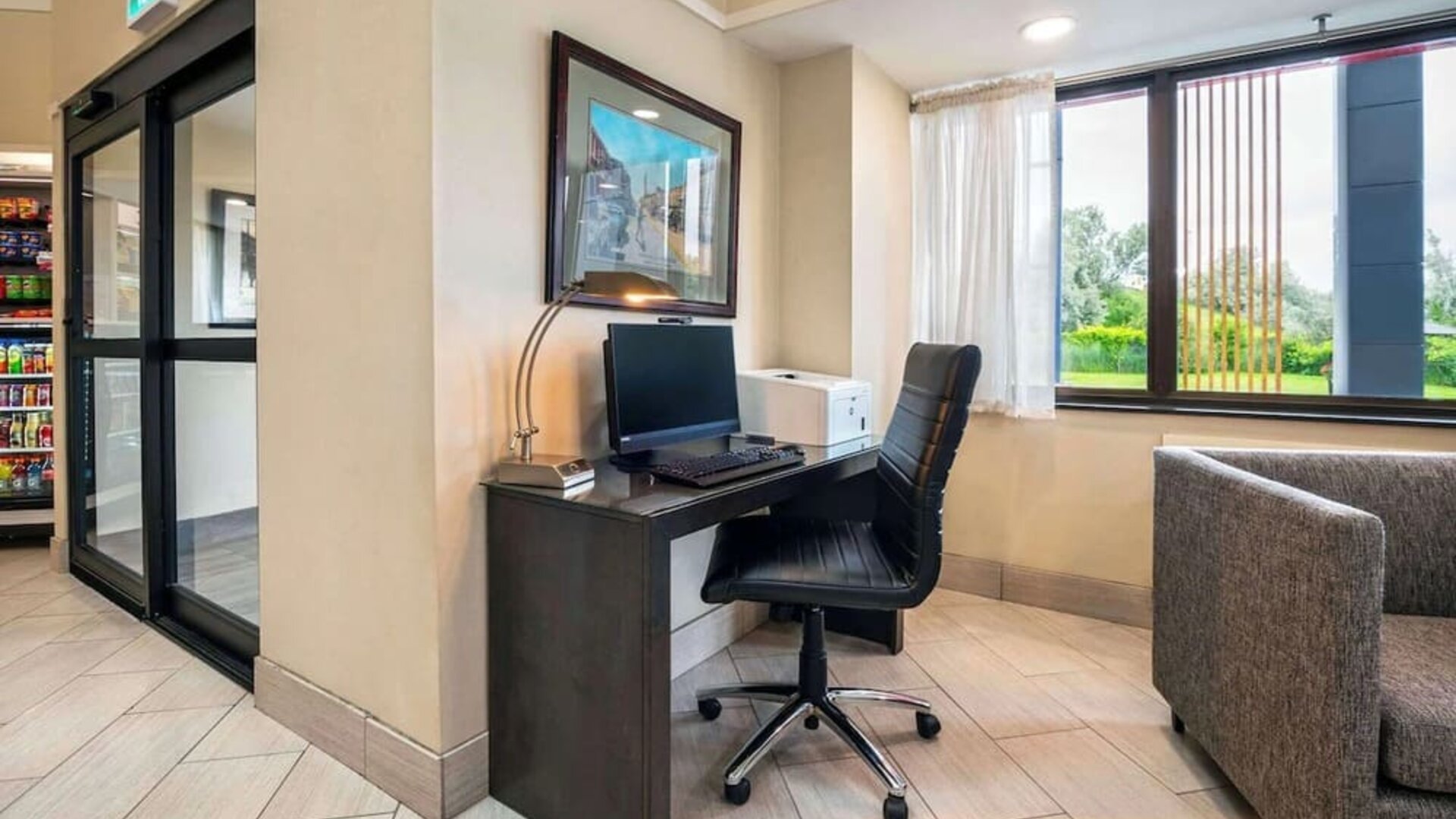 Business center with computer, printer and ergonomic chair at Comfort Inn Newmarket.