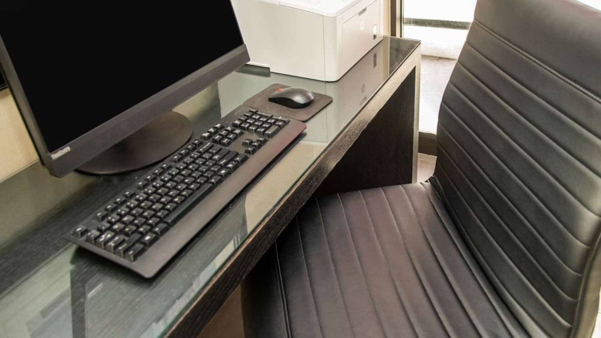 Business center with computer, printer and ergonomic chair at Comfort Inn Ottawa West.