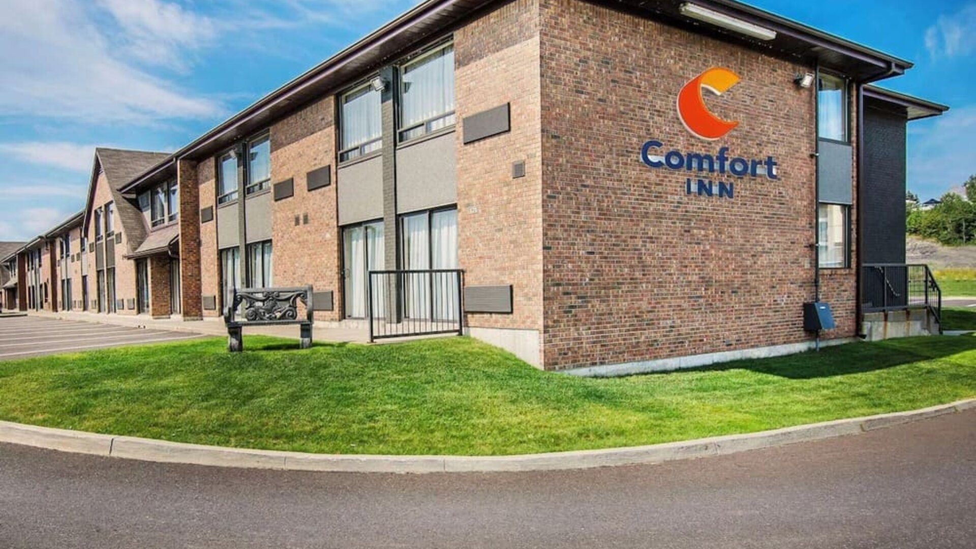 Hotel exterior and parking area at Comfort Inn Edmundston.
