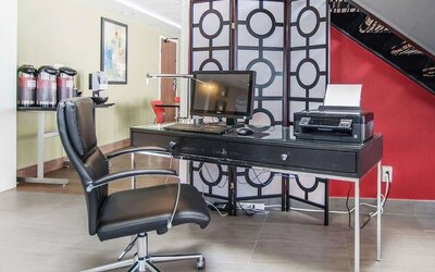 Business center with computer, printer and ergonomic chair at Comfort Inn Edmundston.