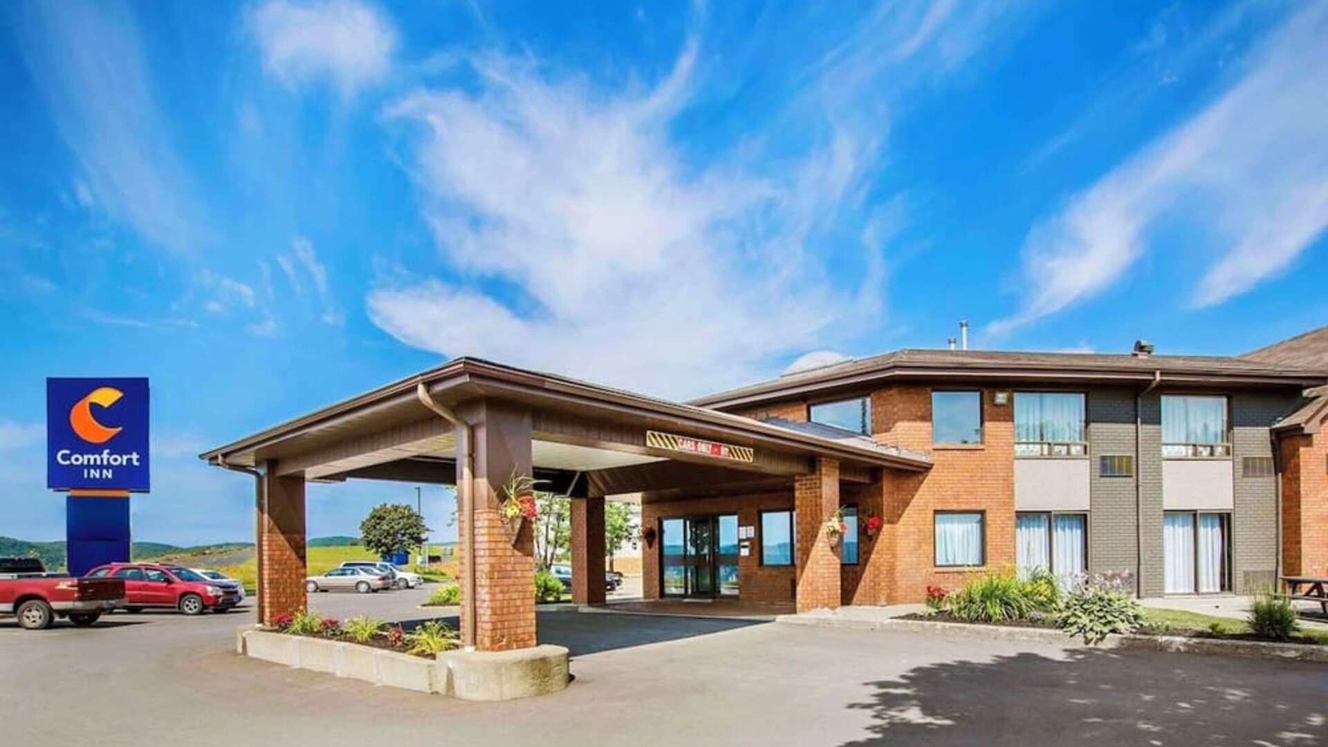Hotel entrance and parking area at Comfort Inn Amherst.