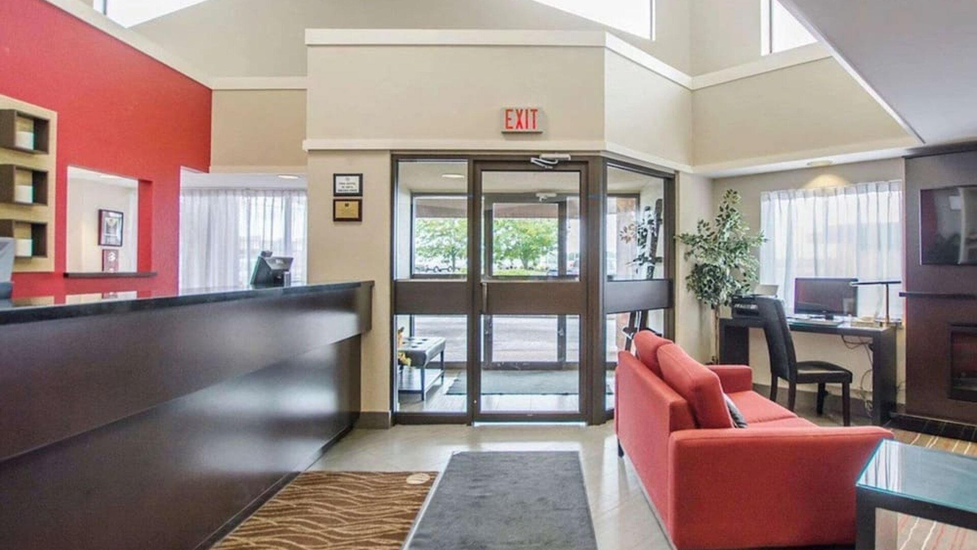 Hotel lobby with lounge area and workspace at Comfort Inn Amherst.