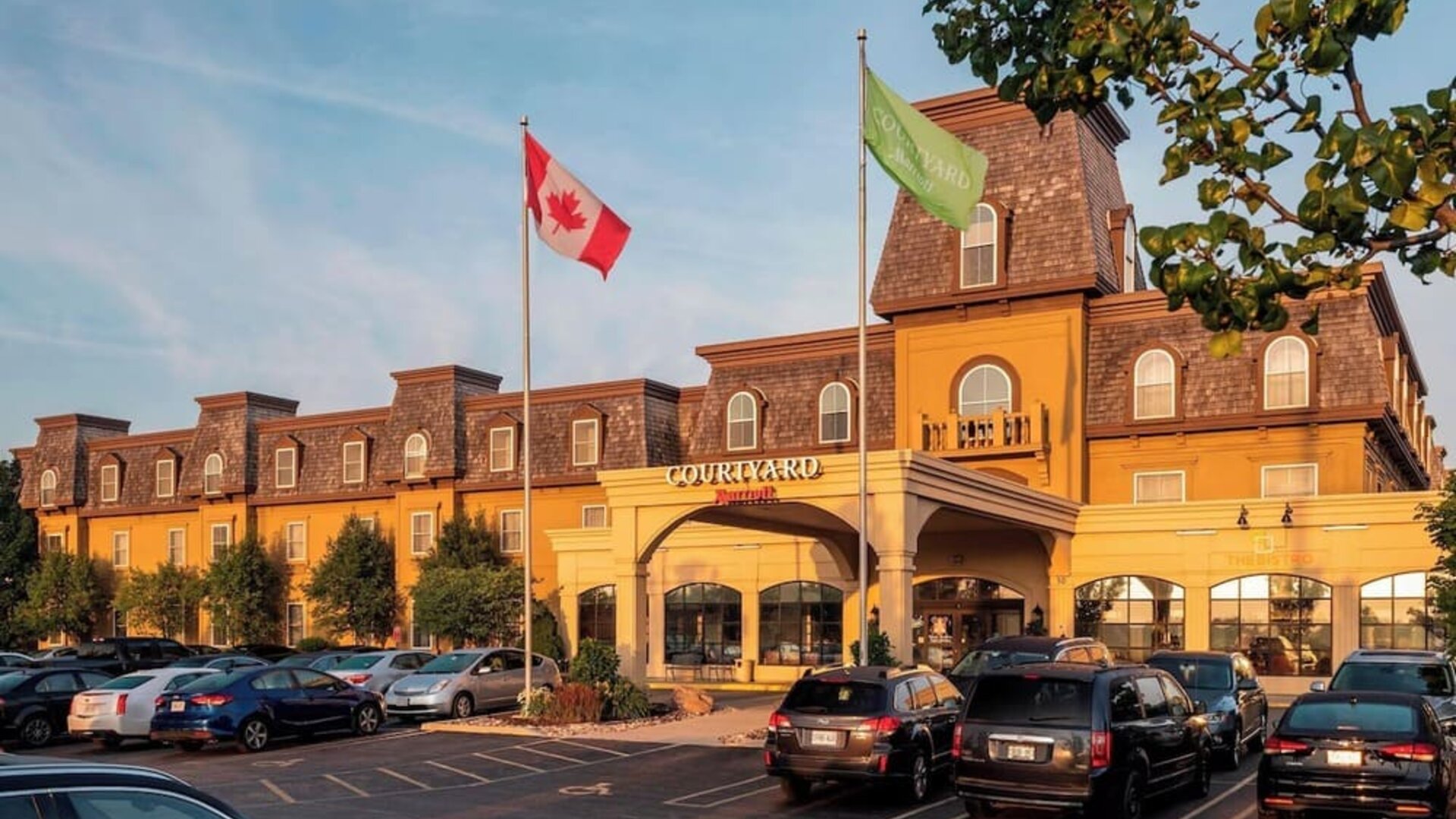Hotel entrance and parking area at Courtyard By Marriott Waterloo St. Jacobs.