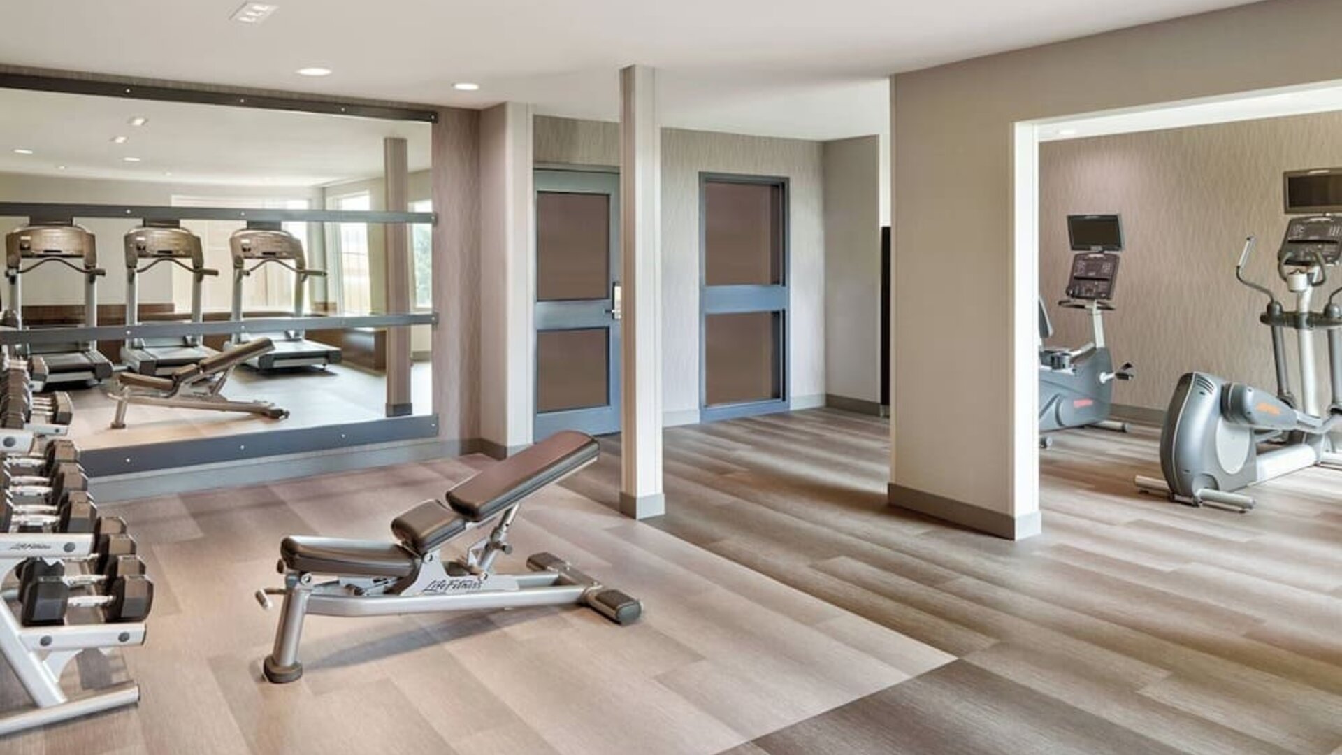 Fully equipped fitness center at Courtyard By Marriott Waterloo St. Jacobs.