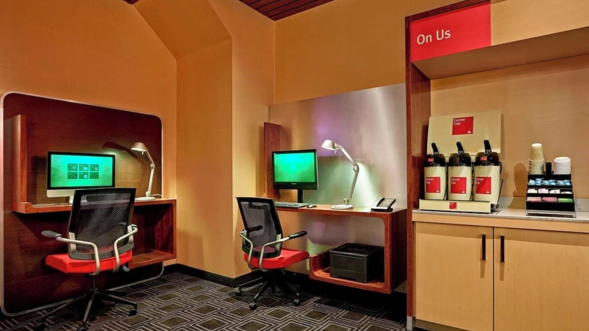 Business center with computers, printers and ergonomic chairs at TownePlace Suites By Marriott London.