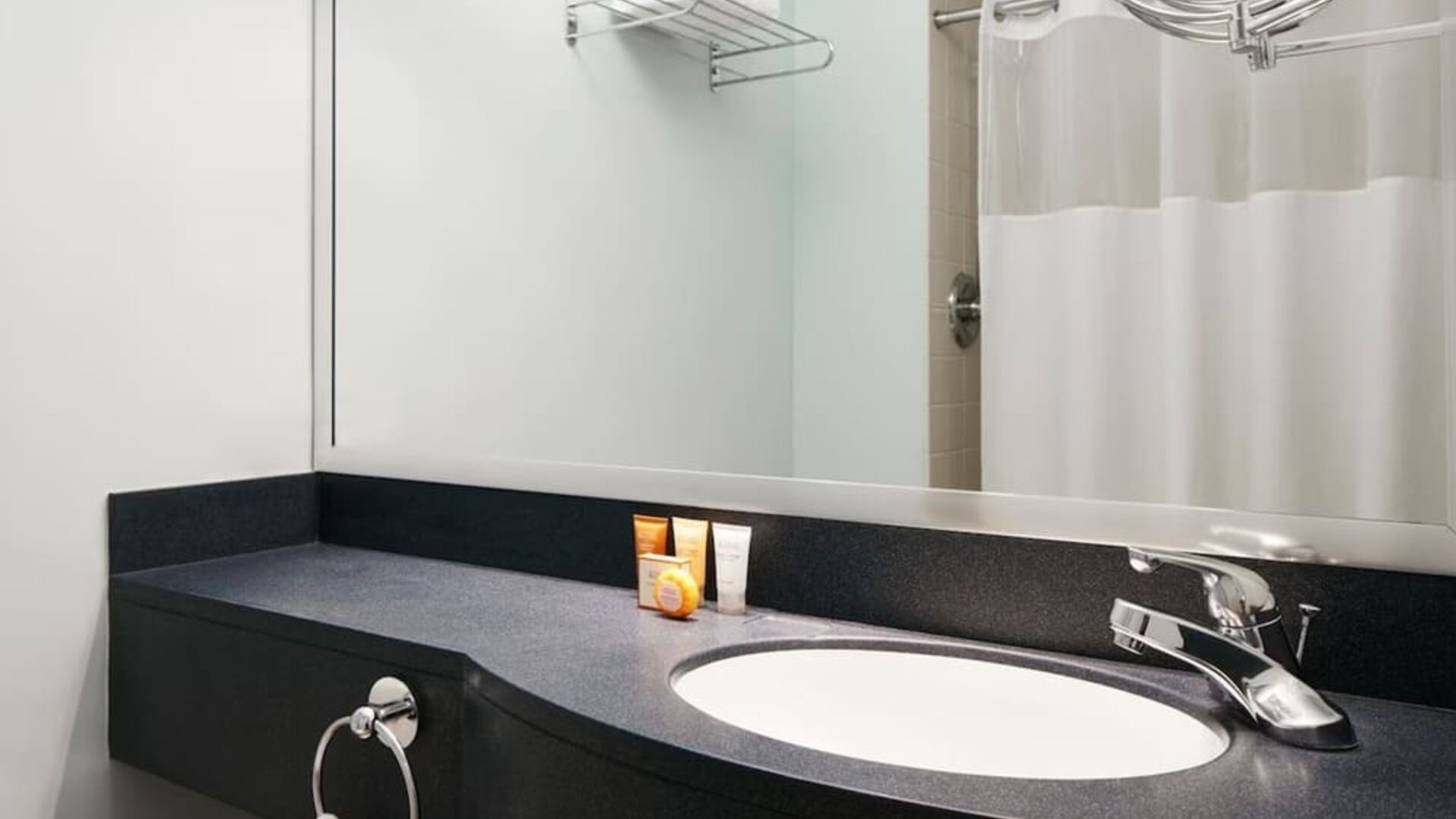 Guest bathroom with shower at Club Quarters Hotel Wacker At Michigan.