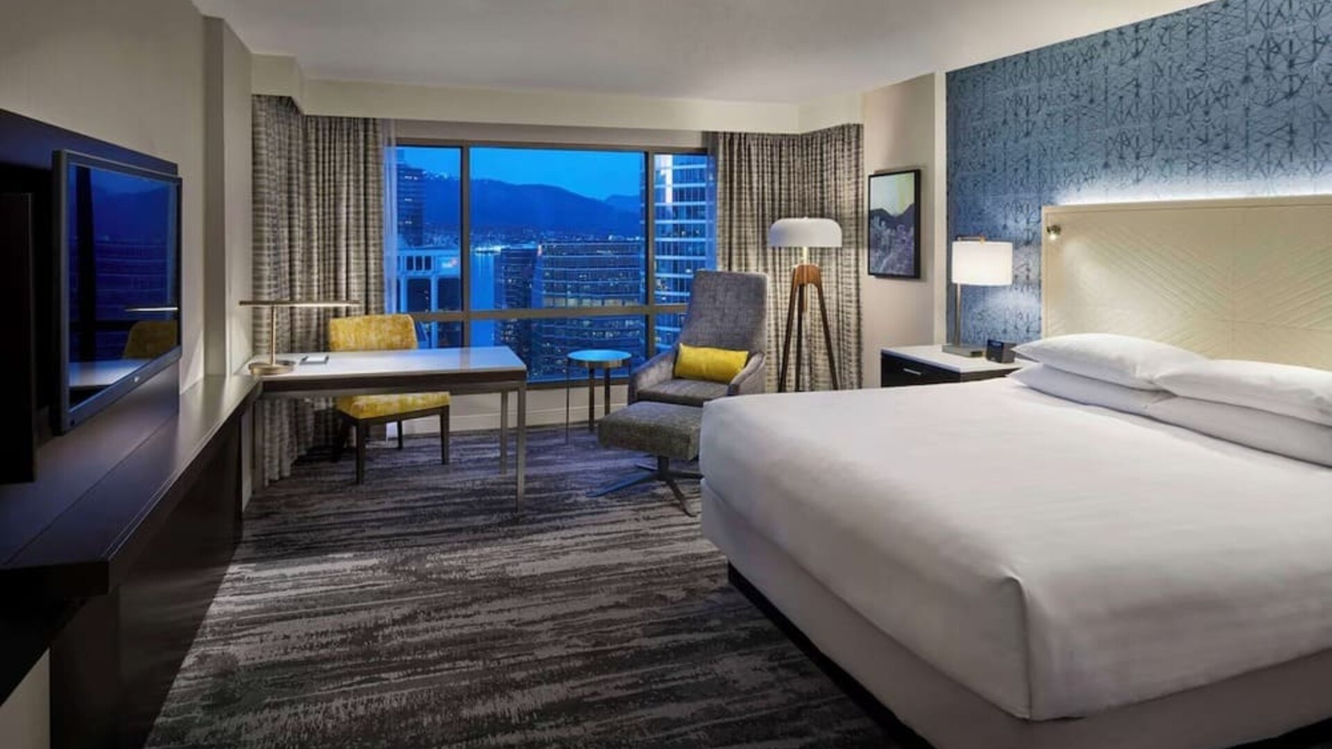Day use room with TV, work desk and sofa at Hyatt Regency Vancouver.